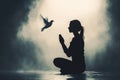 Prayerful Woman Kneels in Reverence with the Holy Spiritâs White Dove Descending from Above Royalty Free Stock Photo