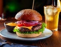 Tasty grilled cheeseburger served with lemonade and mustard. Barbecue hamburger with vegetable Royalty Free Stock Photo
