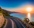 Ligurian road that runs along the sea at dawn Royalty Free Stock Photo