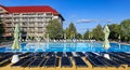 Open air sport swimming pool with cold clear water in a relaxation area with sun loungers in the Golebiewski hotel Royalty Free Stock Photo
