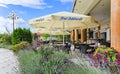 Open veranda of the restaurant with beautiful landscaping and sun umbrellas in the Golebiewski hotel Royalty Free Stock Photo