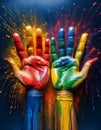 Colorful painted hands on a dark blue background. Holi festival. Royalty Free Stock Photo