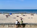 White sandy beach with vacationers on the Baltic Sea coast in Majori Royalty Free Stock Photo