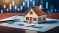 Model of house shot on graph depicting mortgage rates. Royalty Free Stock Photo