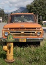 Orange Truck in Juneau Alaska behind Yellow Fire Hydrant Royalty Free Stock Photo