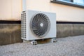 Aircon compressor outside a house Royalty Free Stock Photo
