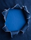 a piece of blue jeans material torn in the middle for text Royalty Free Stock Photo
