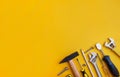 Set of tools on a yellow background. Generated image Royalty Free Stock Photo