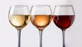 Three wine glasses over white background. White wine, rose, and red. Royalty Free Stock Photo