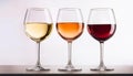 Three wine glasses over white background. White wine, rose, and red. Royalty Free Stock Photo