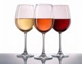 Three wine glasses over white background. White wine, rose, and red. Royalty Free Stock Photo
