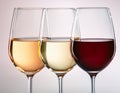 Three wine glasses over white background. White wine, rose, and red. Royalty Free Stock Photo