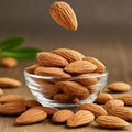 Almonds Almond Nuts Food. Raw almonds pouring out of a glass bowl onto a wood surface. Royalty Free Stock Photo