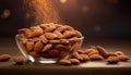 Almonds Almond Nuts Food. Raw almonds pouring out of a glass bowl onto a wood surface. Royalty Free Stock Photo