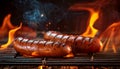 Sausages on the barbecue grill with flames Royalty Free Stock Photo