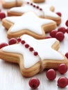 Christmas star cookies with icing and red berries. Royalty Free Stock Photo