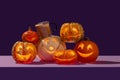 Generated imagePumpkin spiced latte in Halloween setup of variety of happy face pumpkins gang Royalty Free Stock Photo