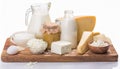 Milk dairy product composition. Group of dairy milk products ingredients on wood board isolated Royalty Free Stock Photo
