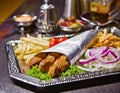 Kebab Fast Food Dish. A fast food dish of Kebab on a tray. Royalty Free Stock Photo