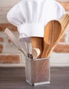 Chef s tools. A chef s toque with various cooking utensils Royalty Free Stock Photo