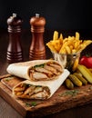 Shawarma wrap with chicken, fries and pickles Royalty Free Stock Photo
