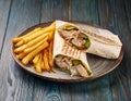 Shawarma wrap with chicken, fries and pickles Royalty Free Stock Photo