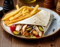 Shawarma wrap with chicken, fries and pickles Royalty Free Stock Photo