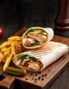 Shawarma wrap with chicken, fries and pickles Royalty Free Stock Photo