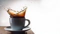 Coffee splash. Cup of spilling coffee creating splash Royalty Free Stock Photo