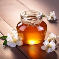 Honey in a glass jar with white flowers on floor board Royalty Free Stock Photo