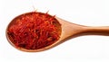Dried bright red saffron in a wooden spoon isolated on white background Royalty Free Stock Photo