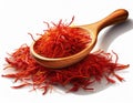 Dried bright red saffron in a wooden spoon isolated on white background Royalty Free Stock Photo