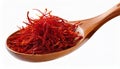 Dried bright red saffron in a wooden spoon isolated on white background Royalty Free Stock Photo