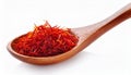 Dried bright red saffron in a wooden spoon isolated on white background Royalty Free Stock Photo