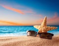 Holidays. sand beach, sunglasses and starfish in front of summer sea background with copy space. Royalty Free Stock Photo