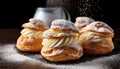 Powdered Cream Puffs. Cream puffs filled with pastry cream and sprinkled with powdered sugar. Royalty Free Stock Photo