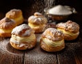 Powdered Cream Puffs. Cream puffs filled with pastry cream and sprinkled with powdered sugar. Royalty Free Stock Photo