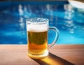 Beer-shot. A beer at the pool. Royalty Free Stock Photo