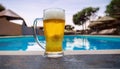 Beer-shot. A beer at the pool. Royalty Free Stock Photo