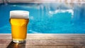 Beer-shot. A beer at the pool. Royalty Free Stock Photo