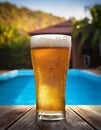 Beer-shot. A beer at the pool. Royalty Free Stock Photo