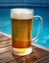 Beer-shot. A beer at the pool. Royalty Free Stock Photo