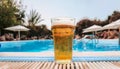 Beer-shot. A beer at the pool. Royalty Free Stock Photo