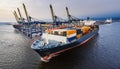 Container ship in port terminal - huge freighter fully loaded Royalty Free Stock Photo