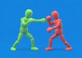 Green character sparring with a red character - competition between two sides Royalty Free Stock Photo