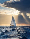 Sailing yacht in the sea at sunset. Dramatic cloudscape. Royalty Free Stock Photo