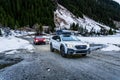 Two off-road Subarus in the mountains in winter on a nature trip. Royalty Free Stock Photo