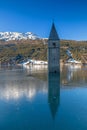 Steeple of Old Curon in lake Reschensee, South Tyrol Royalty Free Stock Photo