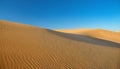 Desert concept, sand dune and blue sky Royalty Free Stock Photo