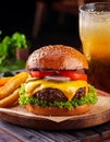 Tasty grilled cheeseburger served with lemonade and mustard. Barbecue hamburger with vegetables and meat Royalty Free Stock Photo